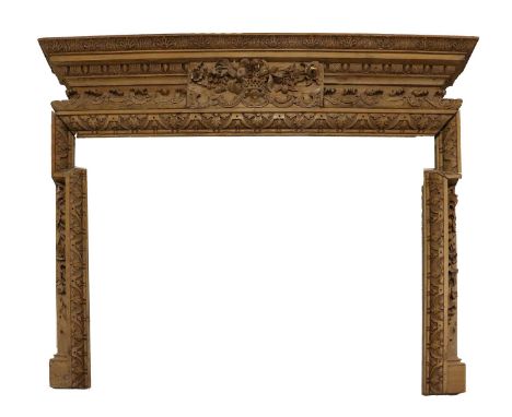 A Carved Pine Chimneypiece, 19th century, with acanthus leaf carved mantel shelf above egg and dart mouldings centred by a ba