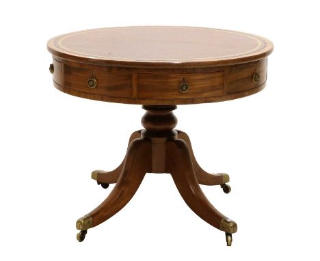 A George III Mahogany Drum Table, early 19th century, with a red and gilt leather skiver above four sham and four real mahoga