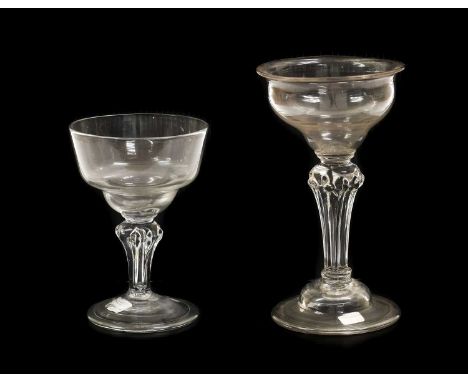 A Champagne or Sweetmeat Glass, circa 1750, the ogee bowl on a pedestal stem and domed base with folded foot16cm highA Simila