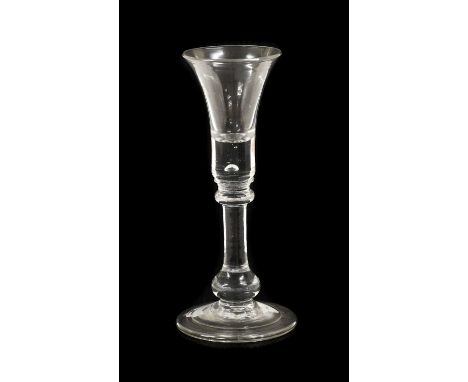 A Wine Glass, circa 1730, the trumpet bowl with air tear to solid base, on a blade and flattened ball knop, baluster stem and