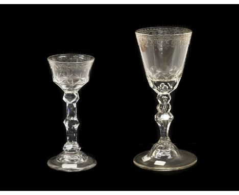 A Wine Glass, probably German, circa 1750, the rounded funnel bowl with engraved foliate and strapwork border and basal facet