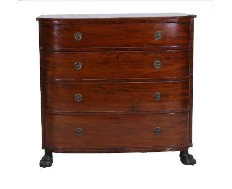 A Regency Mahogany Bowfront Chest of Drawers, early 19th century, the reeded top above four long graduated drawers, on cast m
