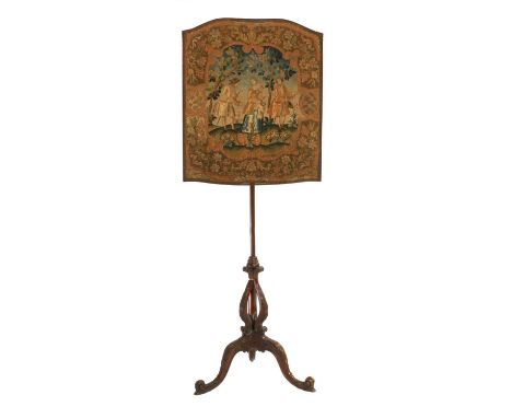 A George III Carved Mahogany Firescreen, late 18th century, the floral needlework panel depicting Classical figures in a land