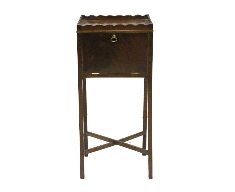 A George III Mahogany Pot Cupboard, circa 1800, with wavy shape gallery and fall front cupboard door, on slender tapering leg