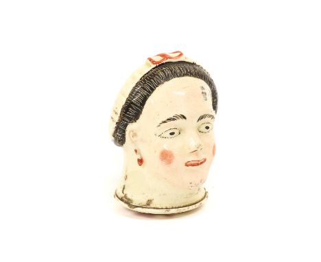 A Creamware Snuff Box and Screw Cover, circa 1780, modelled and painted as the head of a young lady wearing a cap, the cover 