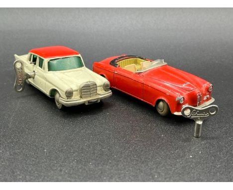 Two Schuco Micro Racers(300g)Schuco Micro Racer 1038 Mercedes 220S with key - Operation not perfect, appears to have been att