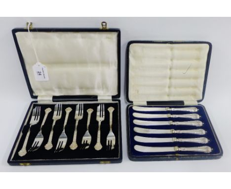 Cased set of six silver pastry forks with celtic knotwork handles, Sheffield 1966 together with a set of six Sheffield silver