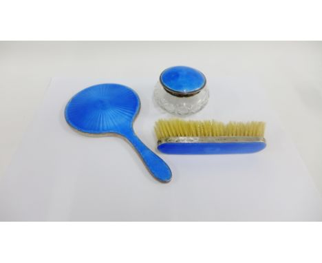 Birmingham silver and blue enamel backed hand mirror and clothes brush together with a similar Birmingham silver and blue ena