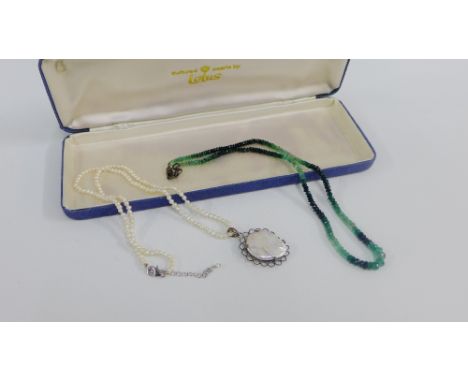 Emerald strand necklace and a freshwater pearl necklace with mother of pearl pendant (2) 