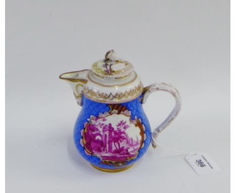 Meissen teapot with a blue scale ground, puce coloured landscape panels and gilt highlights, the lid with a flowerhead knop, 