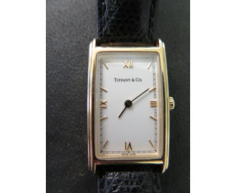 An 18ct yellow gold cased ladies Tiffany & Co wristwatch the rectangular case stamped and marked 750 behind the strap lugs al