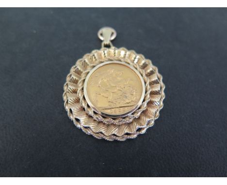A Queen Victoria 1900 Sovereign coin - Within a 9ct gold surround - Hallmarked London - Diameter 4cms - Weight approx 15.7gms