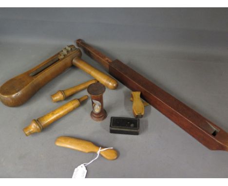 A good collection of Treen items to include two boxwood syringe cases with syringes inside, an egg timer, a boxwood and steel