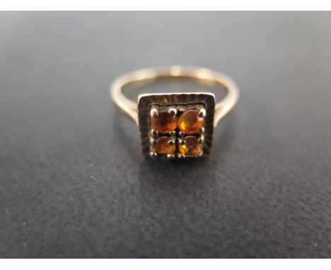 A 9ct gold orange stone panel ring - Hallmarked London - Ring size O - Weight approx 2.9gms
Condition Report: Good to fair - 