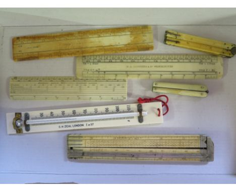 A collection of Scientific ivory items - three 6" rulers with makers name, one four piece one foot ruler, four two piece Engi