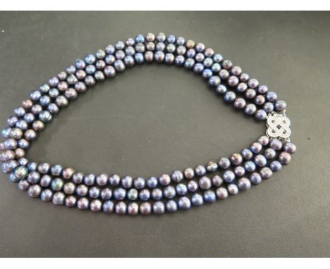 A freshwater cultured pearl three-row necklace - To the paste-set clasp - Length approx 44cms.
Condition Report: Good - With 