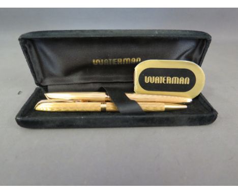 A boxed gold plated Waterman Fountain pen - Hallmarked 18 ct gold nib, lid and barrel with fine pinstripe pattern - serial no