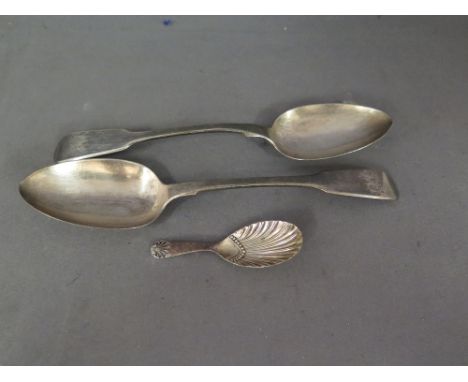 A pair of silver tablespoons, a silver caddy spoon and a silver handled serving knife - Total silver weight approx. 4 troy oz