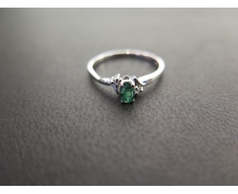 An emerald and diamond dress ring - Stamped 10k - Ring size N - Weight approx 1.5gms
Condition Report: Good to fair - With li