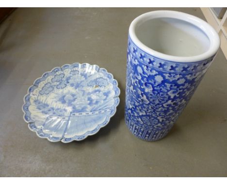 An Oriental blue and white charger with chrysanthemum and prunus decoration - Diameter 46 cm - chips to surface, and a modern