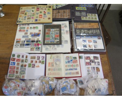 A large collection of stamps - mostly lose and some contained in albums including First Day Editions, fifteen in one album, t