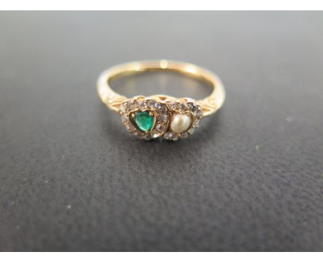 An early 20th century emerald, diamond and seed pearl sweet heart ring - Ring size R 1/2 - Weight approx 3.1gms
Condition Rep