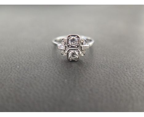 A diamond dress ring - Set with brilliant, baguette and single-cut diamonds - Estimated total diamond weight 0.65ct - Estimat