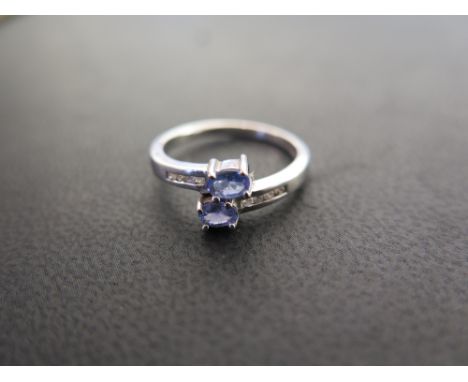 A 9ct gold tanzanite and diamond crossover ring - Hallmarked Sheffield - Ring size L - Weight approx 2.2gms
Condition Report: