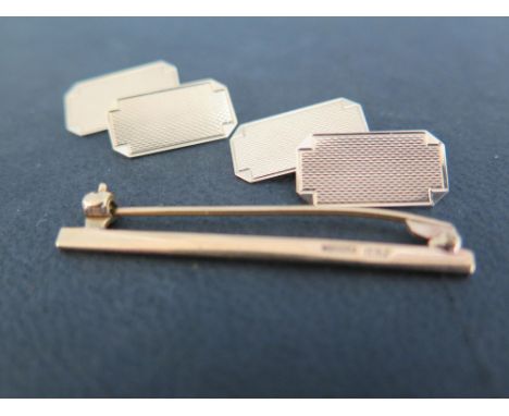 A pair of 9ct gold cufflinks - Together with a 9ct gold tie pin - Length 4.5cms - Both hallmarked Birmingham - Total weight a