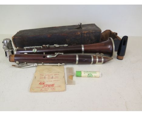 A leather cased rosewood clarinet marked for METZLER and Co Limited London
