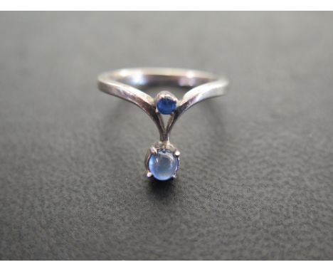 A silver sapphire dress ring - Hallmarked London, 1976 - Ring size N 1/2 - Weight approx 2.2gms
Condition Report: Good - With