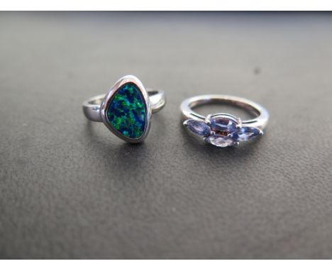 A tanzanite cluster dress ring - Ring size N - Together with an opal doublet ring - Ring size M - Both stamped 925 - Total we