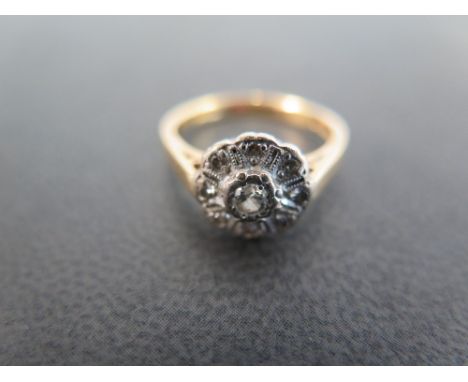 An 18ct gold diamond floral cluster ring - Hallmarked London - Ring size K 1/2 - Weight approx 3.8gms
Condition Report: Good 