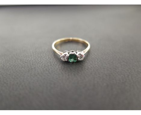 An emerald and diamond three-stone ring - Stamped 18ct Pt - Ring size N - Weight approx 1.7gms
Condition Report: Good - With 