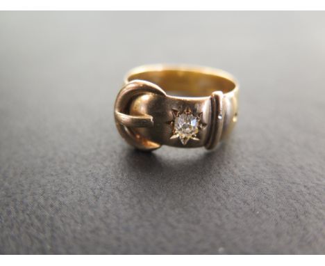 A late Victorian 18ct gold old-cut diamond buckle ring - Estimated diamond weight 0.10ct- Hallmarked London, 1889 - Ring size