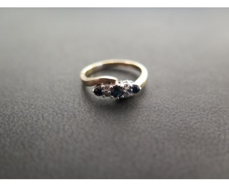 A 9ct gold sapphire and diamond dress ring - Hallmarked London - Ring size K 1/2 - Weight approx 2.6gms
Condition Report: Goo