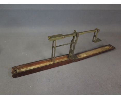An early 19th century mahogany cased set of brass folding sovereign scales by A Wilkinson of Ormskirk late of Kirkby Nr Liver
