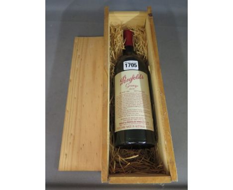 A bottle of Penfolds Grange bin 95 - red wine vintage 1981 bottled 1983 - in wooden base level to base of neck