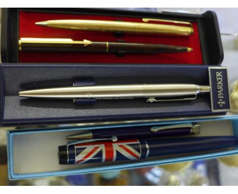 A gold plated Parker propelling pencil, a Parker commemorative ball point pen, a Parker Silver Jubilee ball point pen, a souv