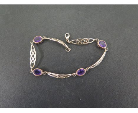 A 9ct gold amethyst Celtic style panel bracelet - Hallmarked Birmingham - Length 20cms - Weight approx 5.0gms
Condition Repor