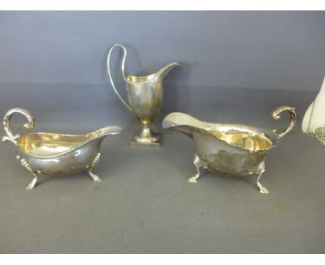 A collection of silver tableware comprising of two Georgian style sauce boats - both hallmarked Birmingham 1971 and a Georgia