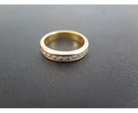 An 18 ct gold and diamond half eternity ring set with eleven diamonds each of approx. 32 points - Total diamond weight approx