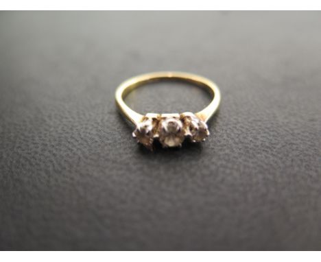 A graduated diamond three-stone ring - Stamped 18ct - Ring size L 1/2 - Weight approx 2.2gms
Condition Report: Good - With li