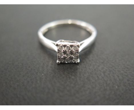 A diamond panel ring - Set throughout with brilliant-cut diamonds - Total diamond weight 0.20ct, stamped to band - Stamped 37
