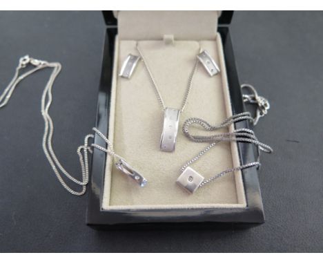 A 'Hot Diamond' set of jewellery - To include a pendant and a pair of earrings - Together with two further pendant necklaces 