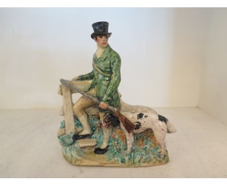 A glazed ceramic group of a Sporting Shoot with his pair of setters by a stile - signed K. Wheeler to base - Kathleen Wheeler