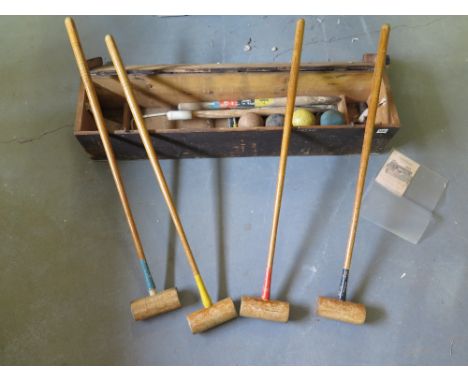 A vintage four person Ayres croquet set 