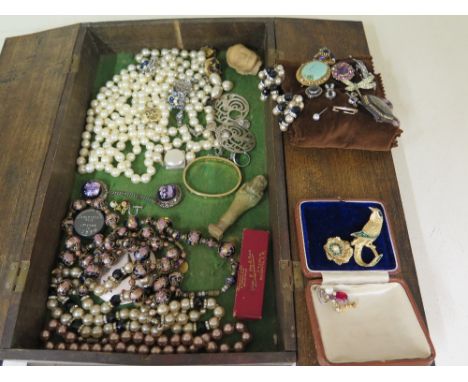 An assortment of vintage and costume jewellery.