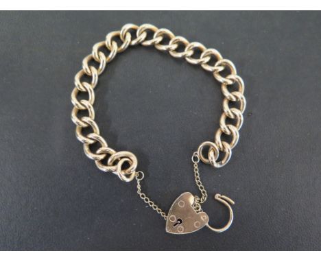 A 9ct gold curb-link bracelet - To the padlock clasp - Hallmarked Birmingham - Length approx 20cms - Weight approx 47.5gms
Co