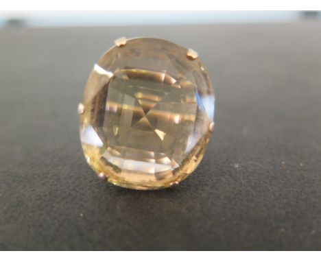 An oval citrine single-stone ring - The oval citrine to the plain band - Tests as 9ct gold - Ring size I - Weight approx 11.8